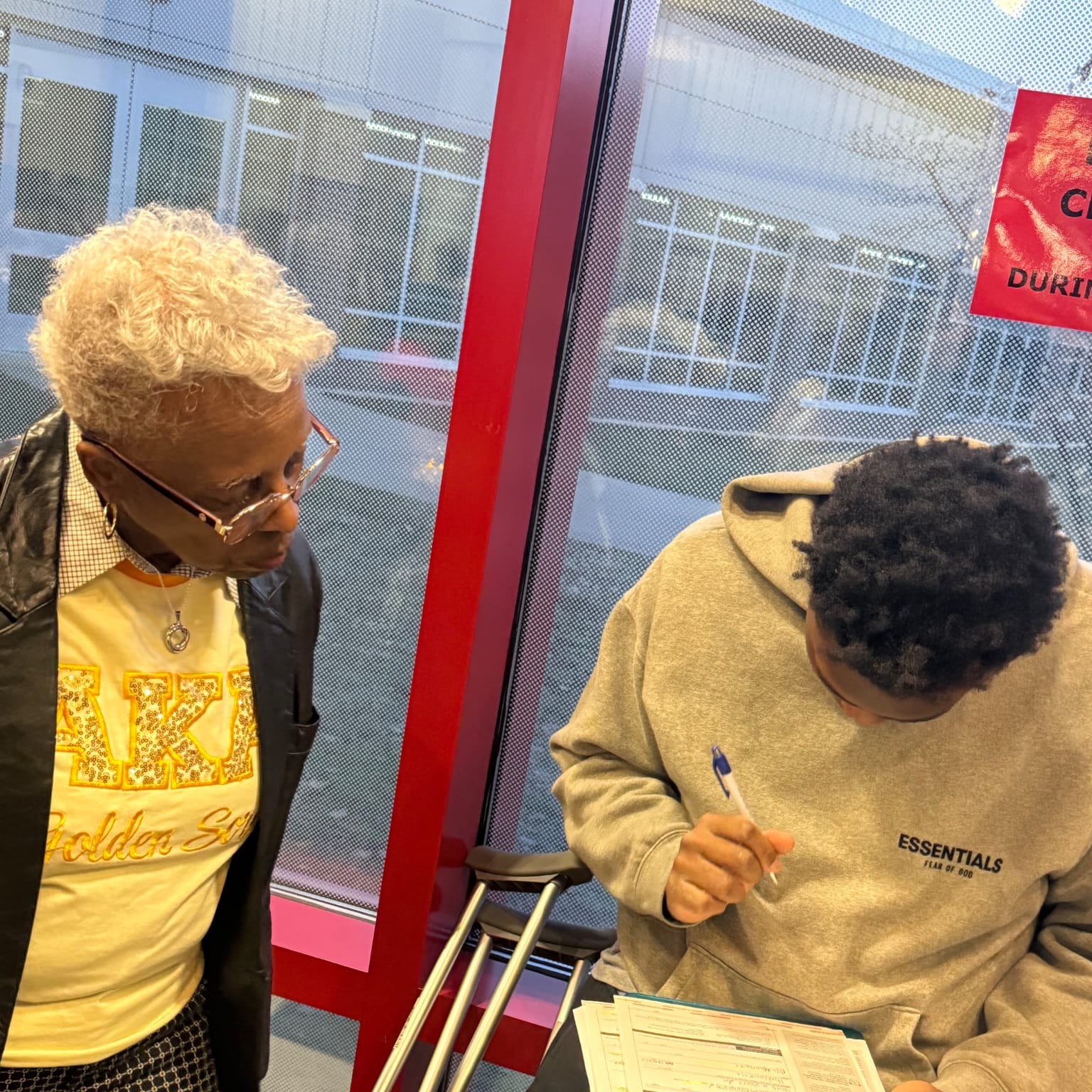 Professor Croom registering a young man to vote